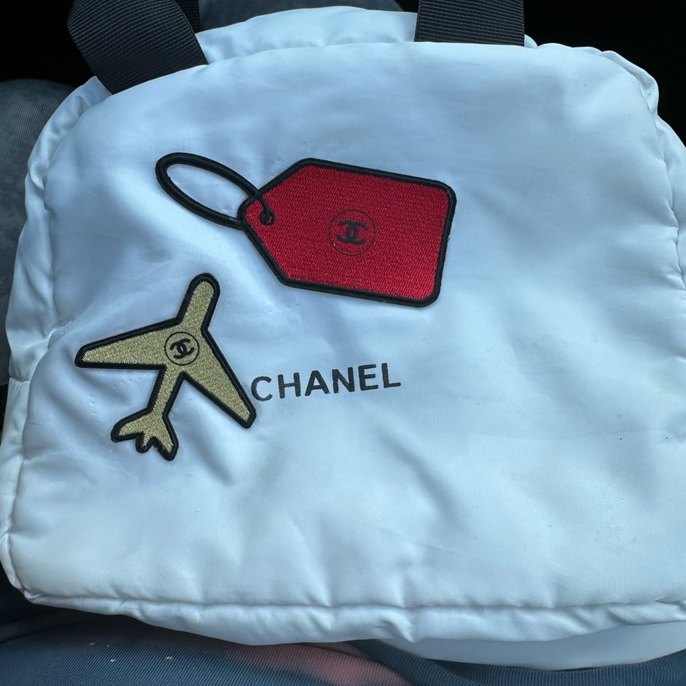 Chanel cosmetic bag with authentic patches. One of a kind item. Offers welcome